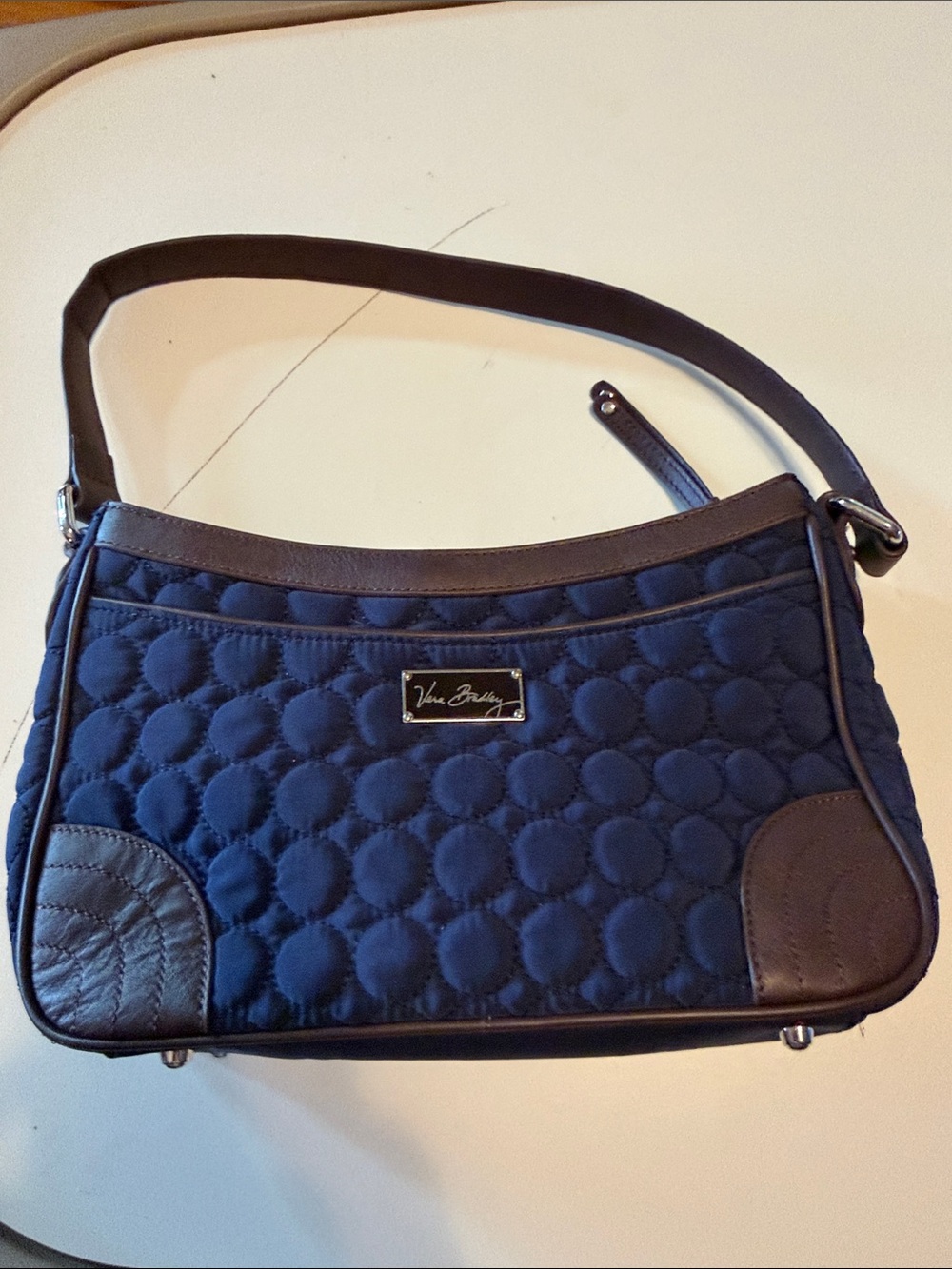 Vera Bradley Wildwood Park microfiber bag. Quilted navy blue with brown strap.